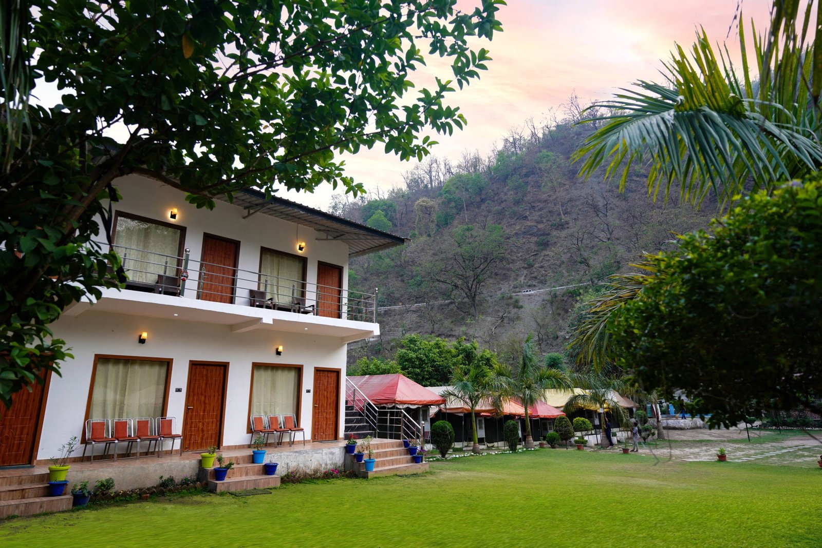 “Adventuria Palm Valley resort cottages set amid greenery and hills in Rishikesh